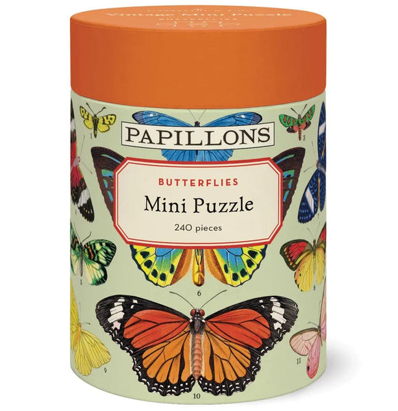 A cylindrical box labeled Vintage 240 Piece Puzzle features colorful butterfly illustrations on a light green background with an orange lid, making it a delightful gift for any puzzle lover.