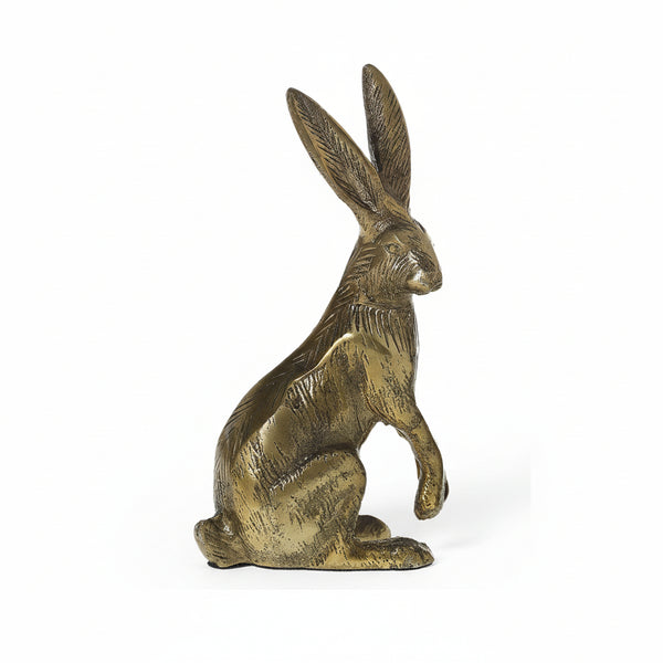 The Gold Rabbit, a brass sculpture finished in antiqued gold with upright ears, is a charming addition to Easter decor against a plain white background.